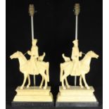 A pair of 'faux ivory' moulded figural table lamps modelled as mounted Chinese warriors, 35cm high