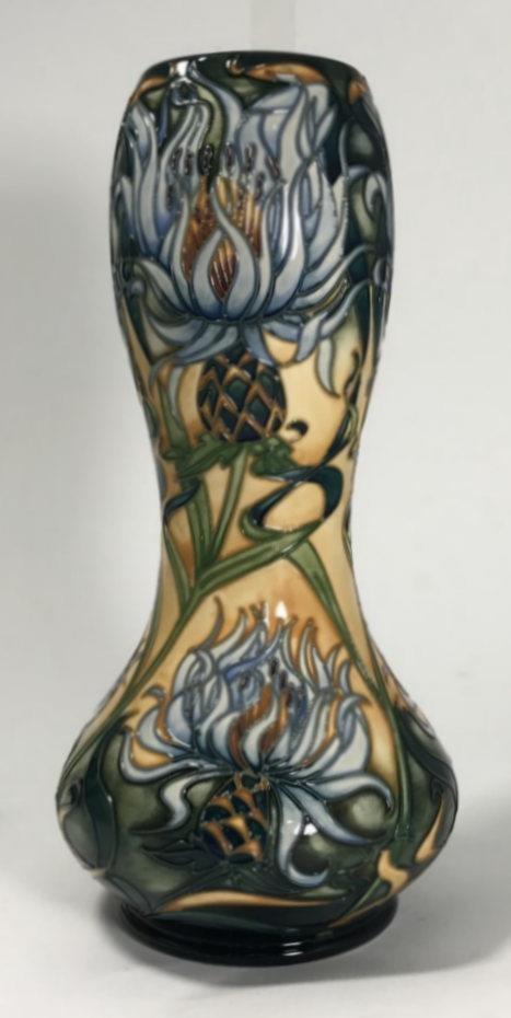 A limited edition Moorcroft pottery vase, of double-gourd shape and decorated in the 'Montana'