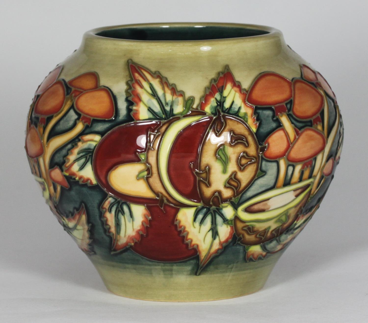 A boxed Moorcroft vase in the 'Mushroom and Conkers' pattern, of globular form, with date symbol