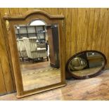 A French walnut and brass mounted bevelled mirror, with arched top and shaped plinth, 130x90cm,