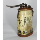 A 20th century horn scrimshaw modelled as an ornamental powder-flask with hinged lid and the sides