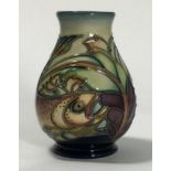 A Moorcroft pottery small vase of ovoid form, decorated in the 'Trout' pattern after Philip