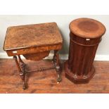 A burr walnut work table with inlaid decoration, the top opening to reveal a fitted, compartmented