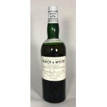 A 1950s/60s bottle of Black & White Blended Scotch Whisky, 70% Vol, by James Buchanan & Co Ltd, with