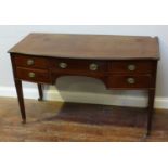 An Edwardian mahogany bow-front side table by Mawer & Stephenson, central frieze drawer flanked by