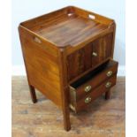 An early 19th century mahogany night table, with galleried top, pair of doors enclosing pot cupboard