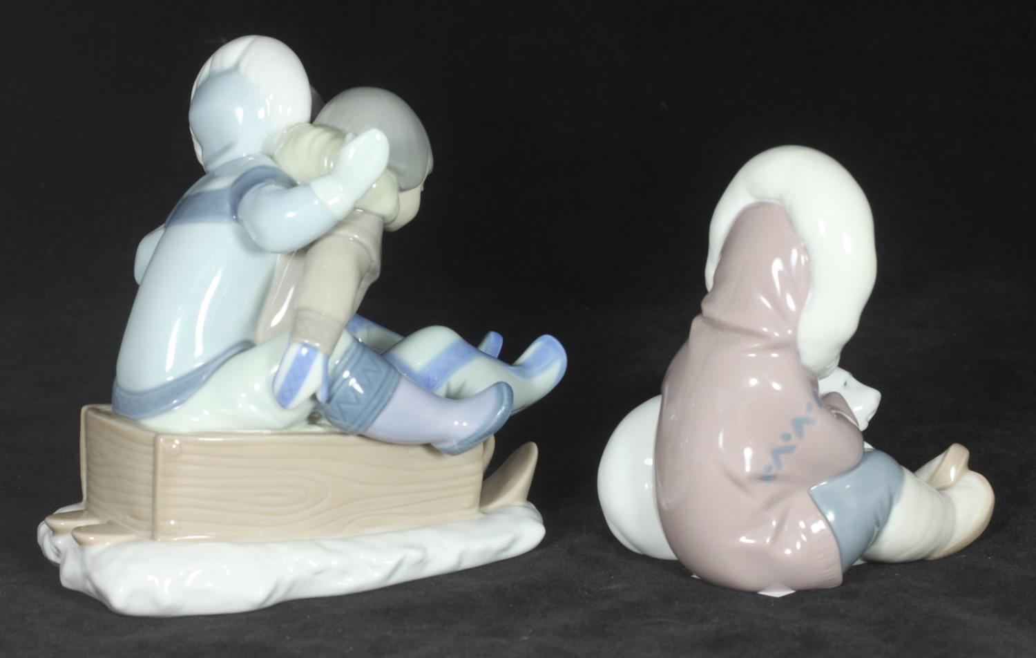 A Lladro porcelain figurine of two children sledging 'Hang On', No. 5665, together with a Lladro - Image 2 of 3