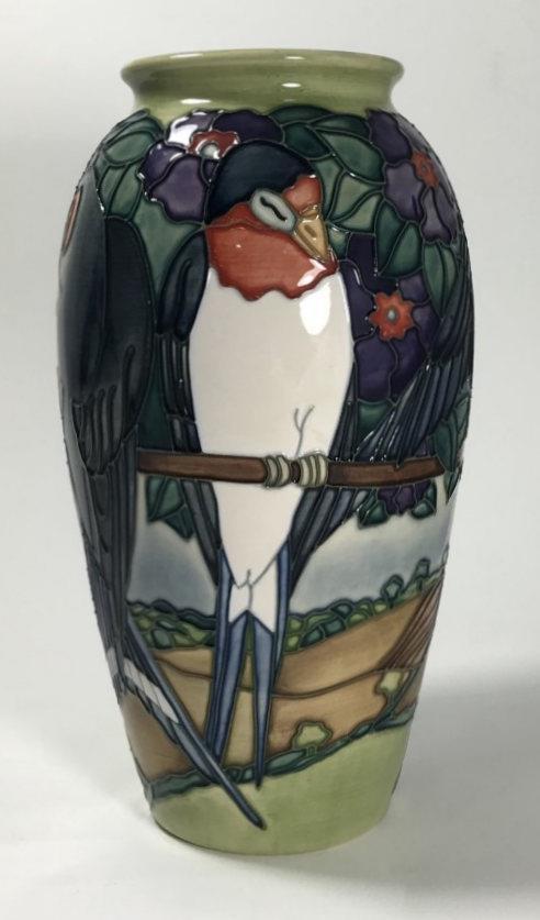 A limited edition Moorcroft pottery vase, of ovoid form, decorated in the 'Swallows' pattern