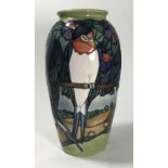 A limited edition Moorcroft pottery vase, of ovoid form, decorated in the 'Swallows' pattern