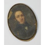 19th Century School. Oval portrait miniature of a young man wearing frock coat and scarf,