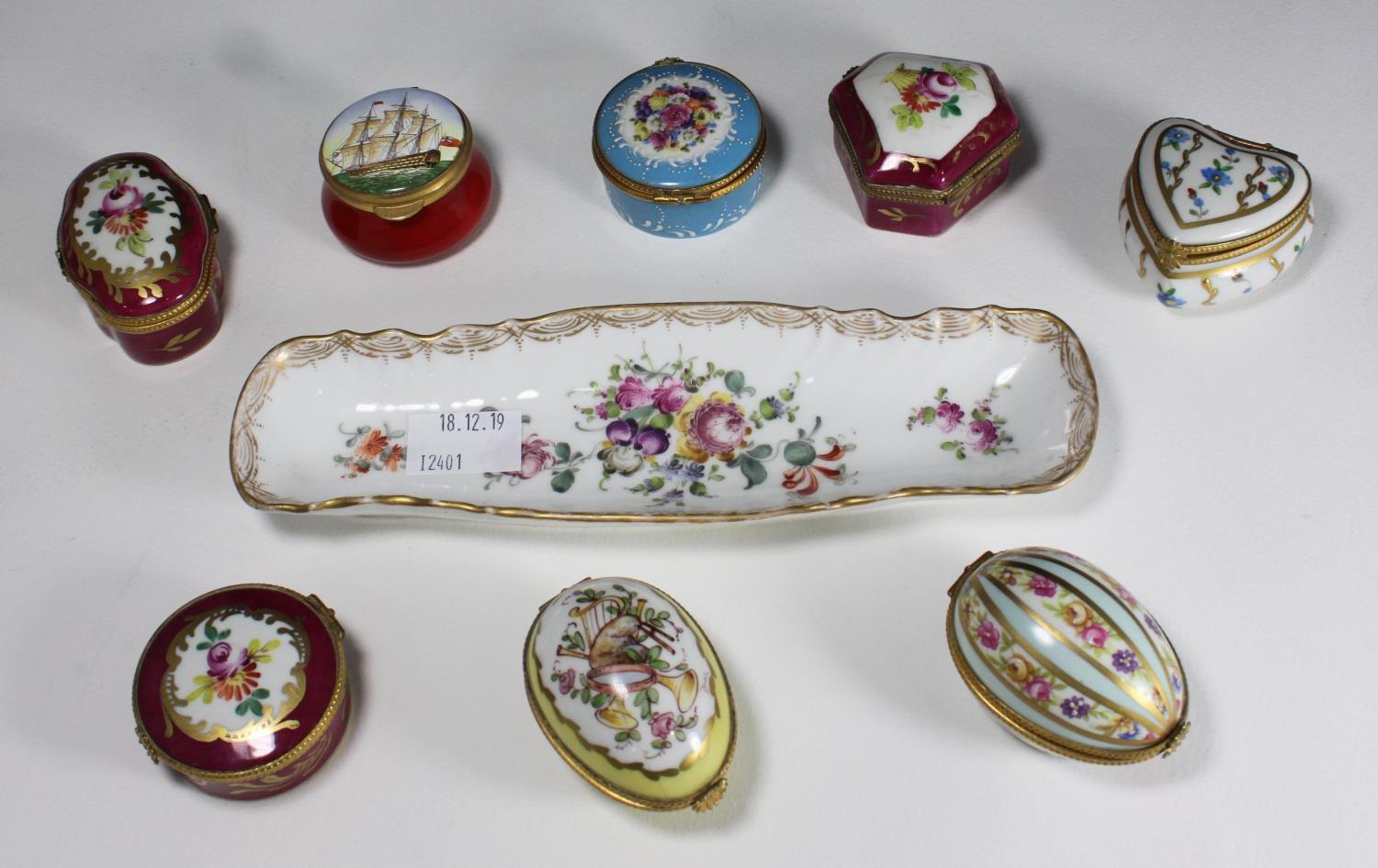 Seven enamelled French porcelain shaped boxes with gilt-metal-mounted hinged covers and polychrome