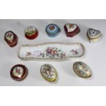 Seven enamelled French porcelain shaped boxes with gilt-metal-mounted hinged covers and polychrome