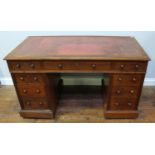 A 19th century stained mahogany twin pedestal desk, inset gilt-tooled red leather scribe, with