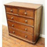 A 19th century stained walnut chest of two short and three long graduated drawers, with turned pulls