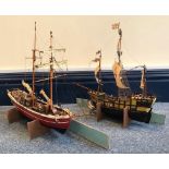 A hand-built model of a galleon together with another hand-built model of a sailing ship (2)