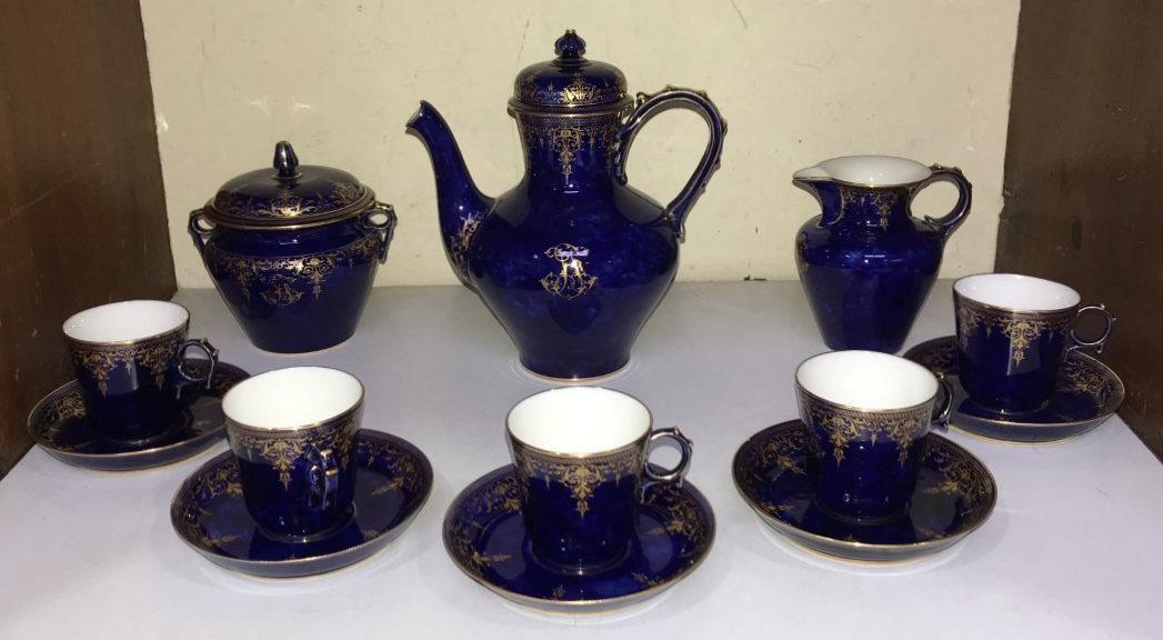 SECTION 5. An early 20th century Sevres porcelain part coffee set with gilt-Arabesque decoration