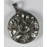 A mid 20th Continental diamond disc pendant, possibly Portuguese, set to the silver front with eight