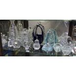 A shelf of assorted glass including a decanter and stopper of spiral design, together with a