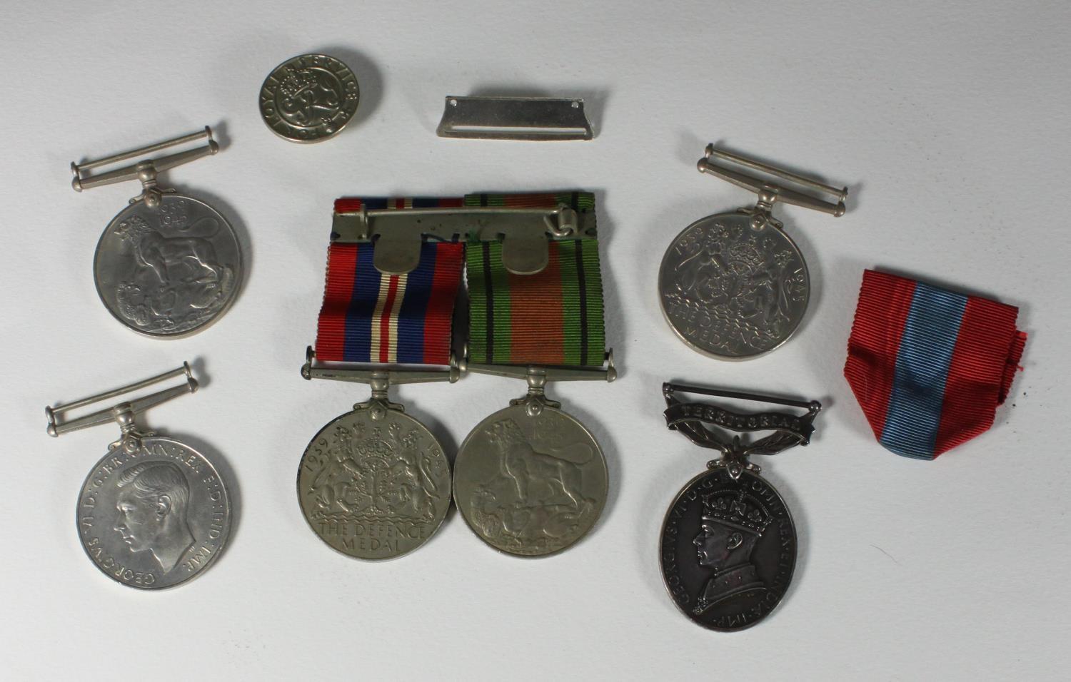 A small collection of assorted un-named WWII medals including the 1939 - 1945 Defence medal and