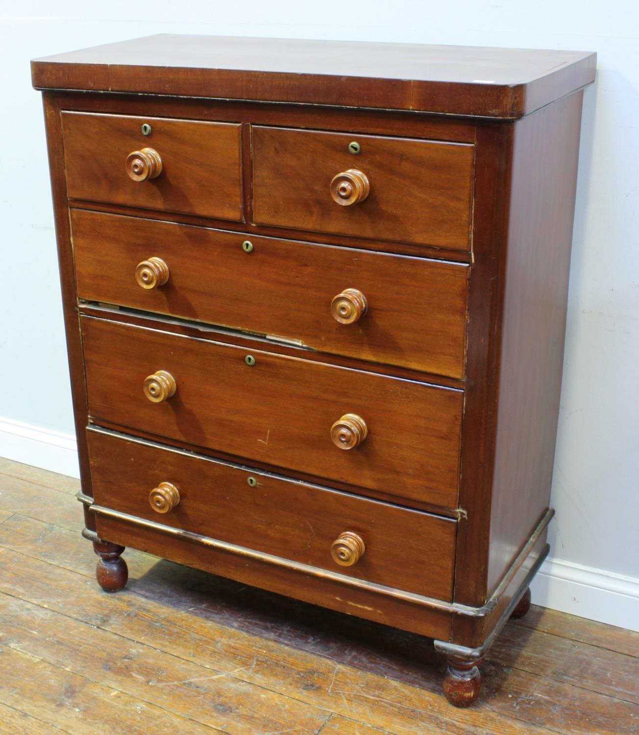 A 19th century stained walnut chest of two short and three long graduated drawers, with turned pulls