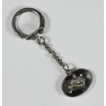 A silver key ring with horse-head pendant, pendant baring makers mark 'C&C', hallmarked