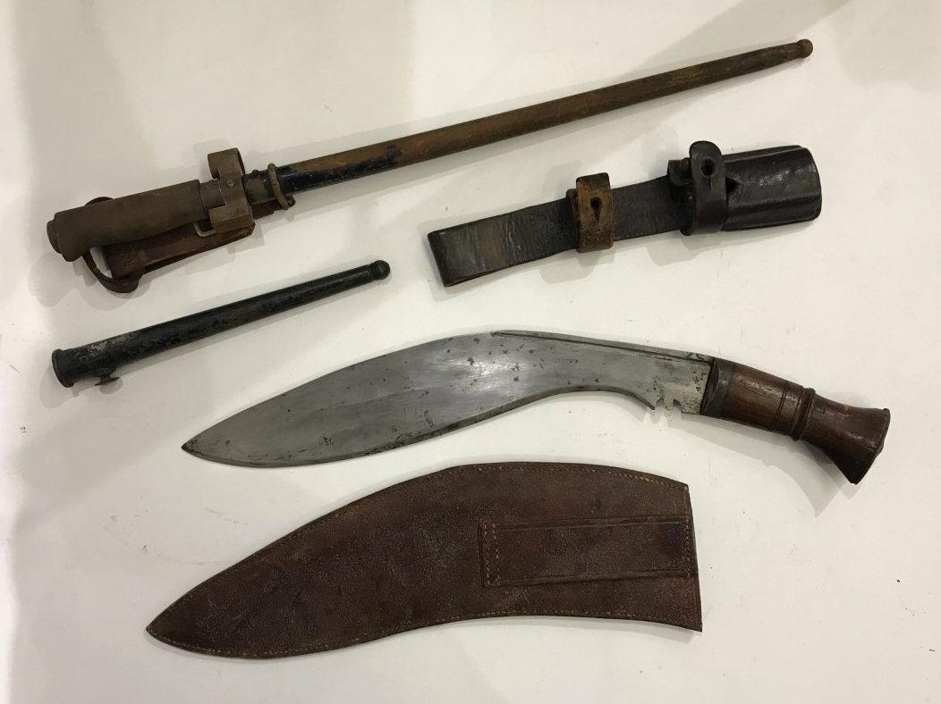 M1886 Lebel bayonet with cruciform blade and metal scabbard, together with a Nepalese Kukri knife, a