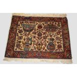 Tabriz pictorial mat, north west Persia, circa 1940s-50s, 2ft. 3in. X 2ft. 10in. 0.69m. X 0.86m.