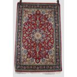 Esfahan part silk rug, mid-20th century, 3ft. 8in. X 2ft. 5in. 1.12m. X 09.74m. Dark red cartouche