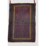 Three tribal weavings, the first: Baluchi prayer rug, Khorasan, north east Persia, early 20th