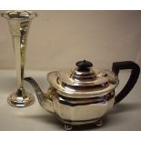 A silver teapot, the rectangular body with angled corners, having a reeded edge flange, a facetted