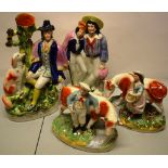Two groups of Victorian Staffordshire figures, The Wounded Soldier, 12.25in (31cm) and 'Dog Tray'