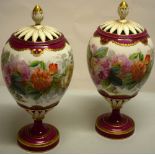 A pair of nineteenth century porcelain pot pourri vases, painted roses, gilt edged magenta