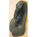 An Inuit stone carving of a long billed gull, the base inscribed Tinapi, 12.5in (32cm)