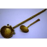 A Dutch scallop bowl ladle, with a turned handle, 15.25in (39cm) together with a Welsh brass lowe