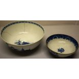 A first period Worcester porcelain punch bowl with blue and white decoration of oriental scenes of a