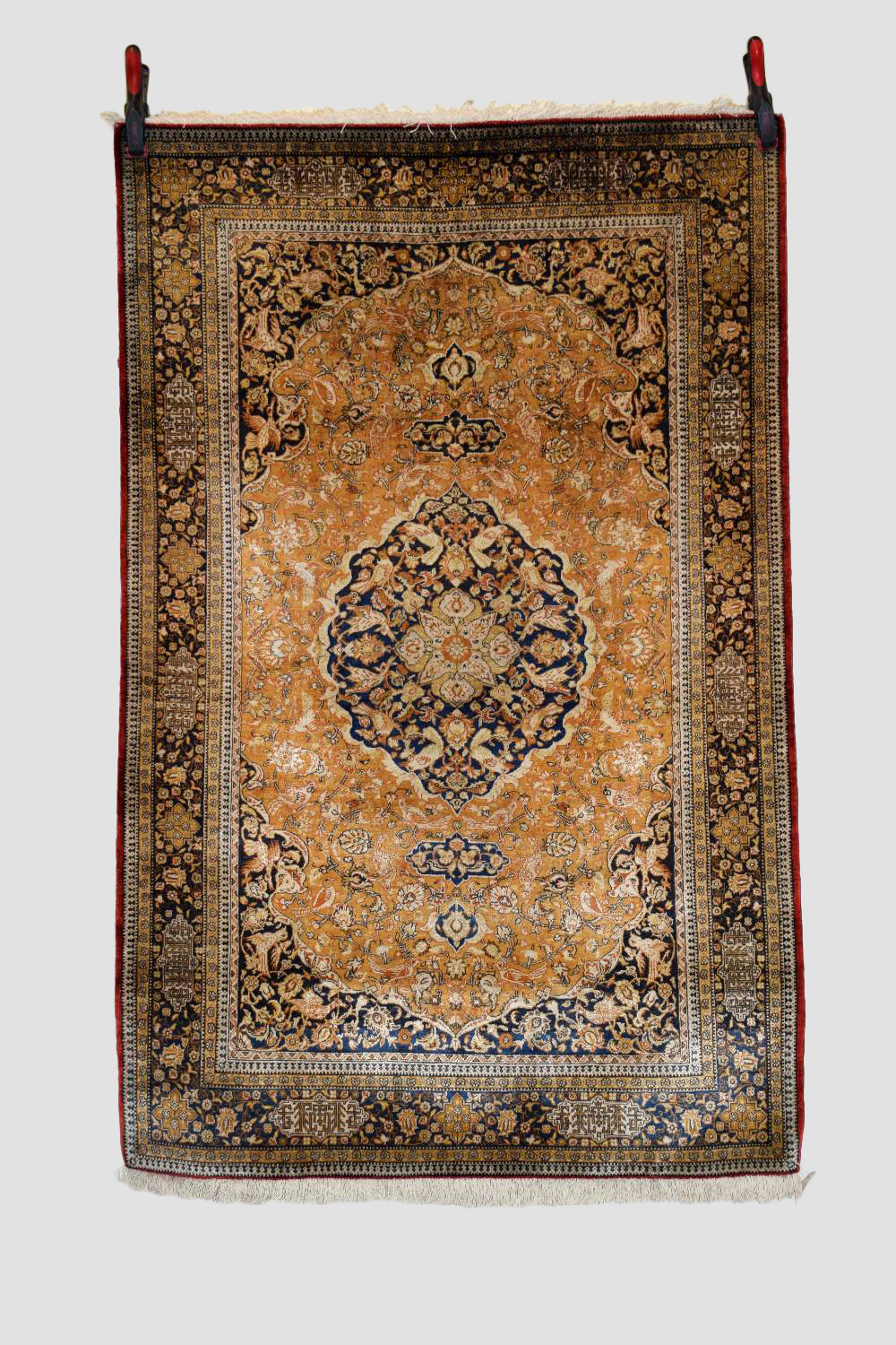 Silk Qum rug, central Persia, mid-20th century, 5ft. 5in. X 3ft. 6in. 1.65m. X 1.07m. Pale gold