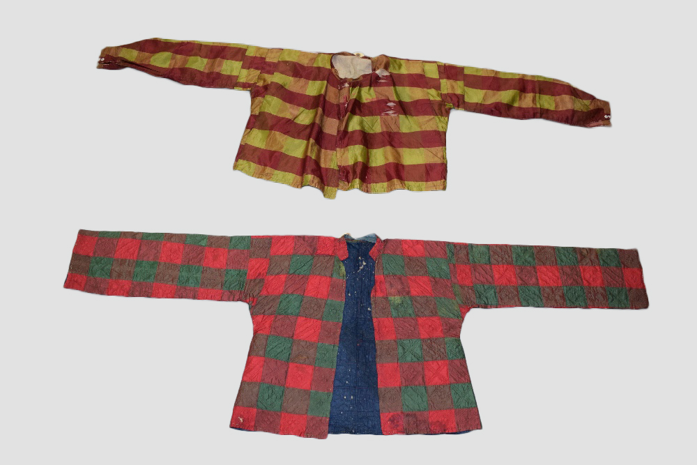 Two Syrian chequered silk boleros, early 20th century, one in bright reds and greens, the squares