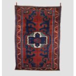 Kazak rug, south west Caucasus, circa 1920s, 8ft. 5in. X 5ft. 11in. 2.56m. X 1.80m. Dark earthy-