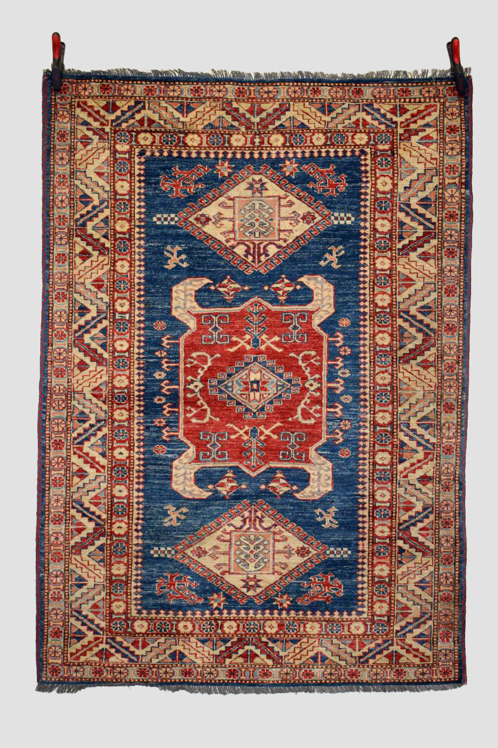 Chobi rug of Caucasian design, Afghanistan, late 20th century, 5ft. 11in. X 4ft. 3in. 1.80m. X 1.