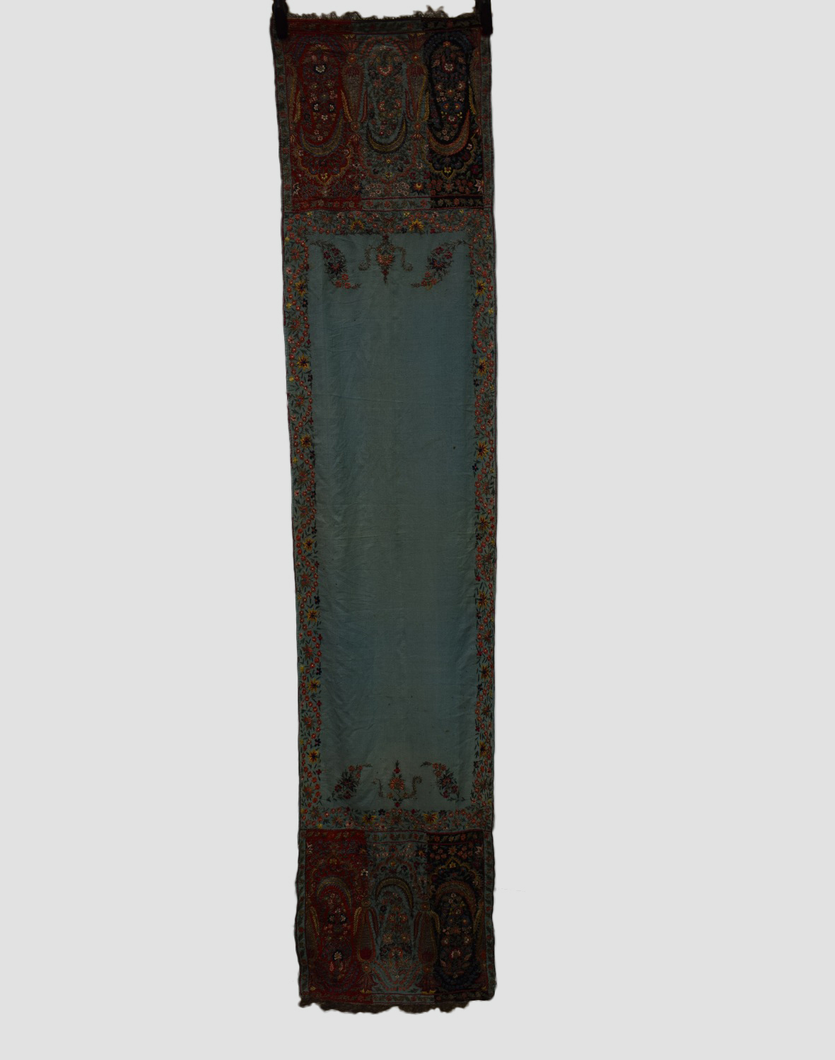 Kashmir stole, north India, early 20th century, 99in. X 22in. 251cm. X 56cm. The pale green fine
