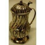 A Dutch eighteenth century silver baluster mustard pot, swirl fluted interspersed with scrolls,