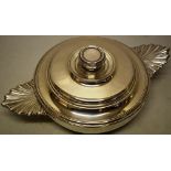 A French Louis XV silver ecuille, the bowl with two fluted side handles, the raised lid with a
