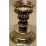 A nineteenth century silver pricket candlestick, the ribbed vase shape holder with a foliage