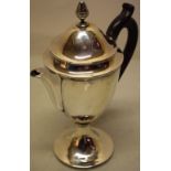 A George III silver argyle, the vase shape body with remains of a crest, having a scroll spout,