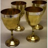 A set of four Victorian parcel gilt silver goblets, the bowls on knopped stems to circular bases,