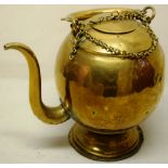 A nineteenth century brass kettle, with a swan neck spout, the swing handle with a chain, on a domed