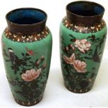A pair of late nineteenth century Japanese cloisonné green enamel vases, with pink blossom and