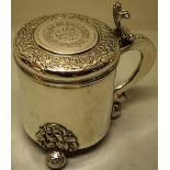 A Scandinavian silver lady's tankard, the cylindrical body on pierced repousse applique