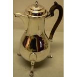 A French Louis XVI provincial silver coffee pot, the baluster body with a scroll spout, the hinged