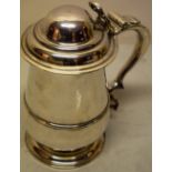 A late George II silver quart baluster tankard, with a girdle moulding, the domed hinged lid with